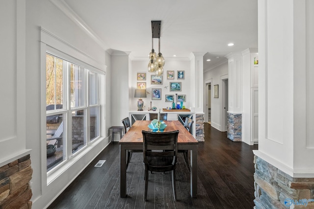 dining room with visible vents, dark wood-type flooring, and ornamental molding