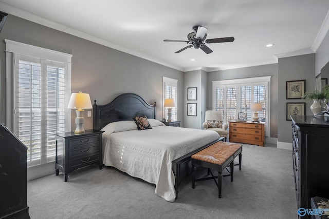 bedroom with crown molding, a ceiling fan, baseboards, and carpet floors