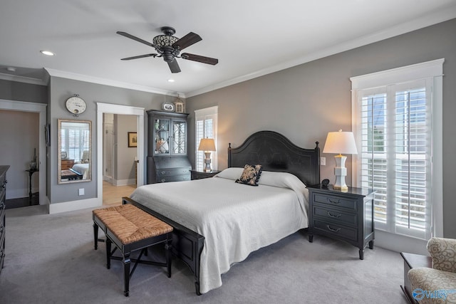 carpeted bedroom featuring recessed lighting, baseboards, ceiling fan, and crown molding