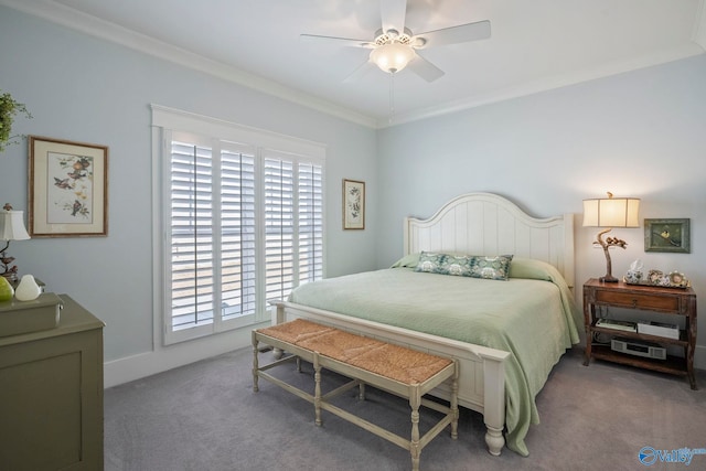 carpeted bedroom with a ceiling fan and ornamental molding