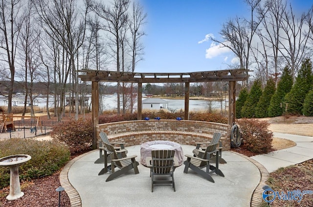 view of patio with fence and an outdoor fire pit