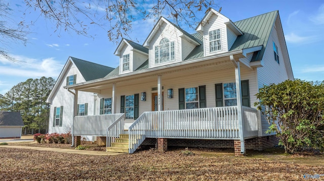 cape cod house with a porch