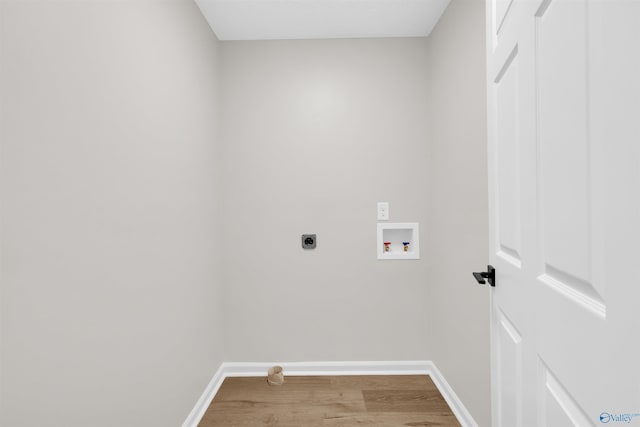 laundry room featuring hookup for an electric dryer, washer hookup, and wood-type flooring