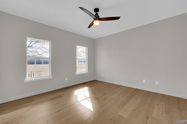 unfurnished room with ceiling fan and light hardwood / wood-style flooring