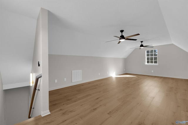 bonus room featuring light wood-type flooring, ceiling fan, and lofted ceiling