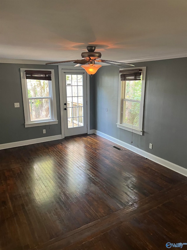 spare room with ceiling fan and crown molding