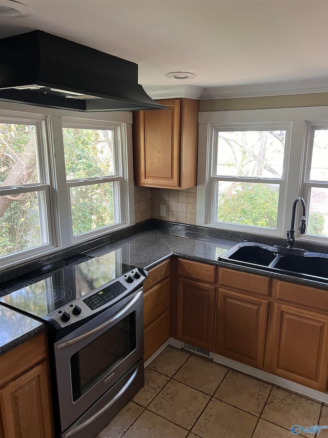 kitchen featuring a healthy amount of sunlight, sink, ventilation hood, light tile patterned flooring, and stainless steel electric range