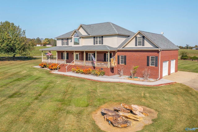 view of front facade featuring a porch, a garage, and a front lawn