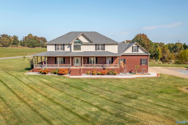 farmhouse-style home featuring a porch and a front yard