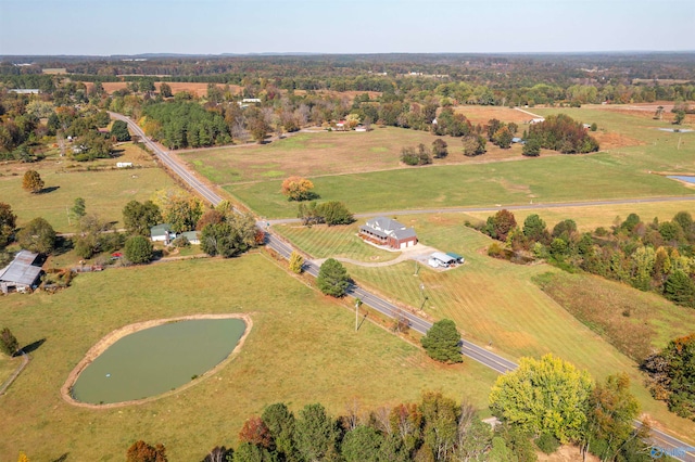 aerial view with a rural view and a water view