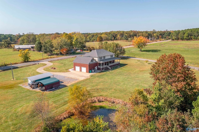 birds eye view of property featuring a rural view