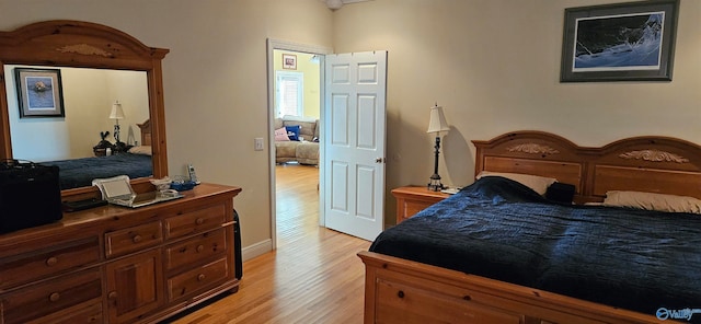 bedroom with light hardwood / wood-style floors