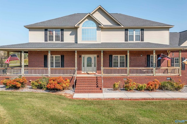 view of front of house with a front lawn and a porch