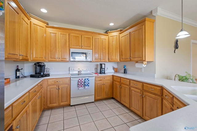 kitchen with sink, decorative light fixtures, white appliances, light tile patterned floors, and ornamental molding