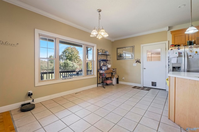 kitchen with stainless steel refrigerator with ice dispenser, crown molding, light tile patterned floors, an inviting chandelier, and hanging light fixtures