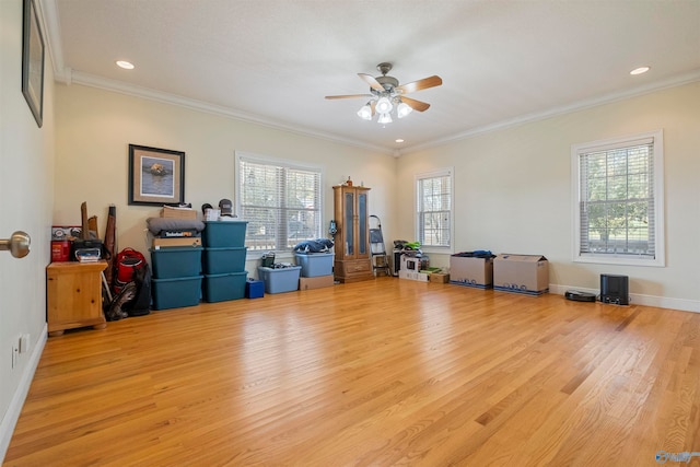 miscellaneous room with ceiling fan, light wood-type flooring, and crown molding