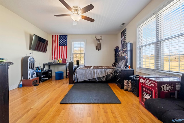 bedroom featuring ceiling fan and light hardwood / wood-style flooring