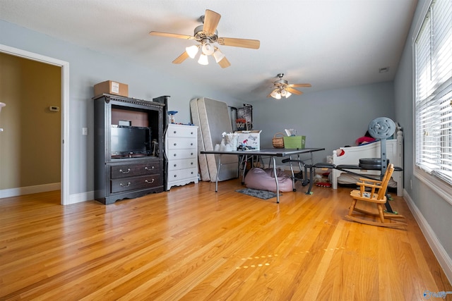 interior space with light hardwood / wood-style floors and ceiling fan