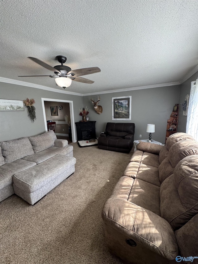 living room with a textured ceiling, carpet floors, crown molding, and ceiling fan