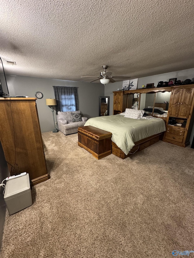 carpeted bedroom featuring a textured ceiling