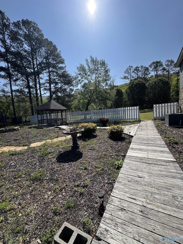 view of dock with a gazebo and fence