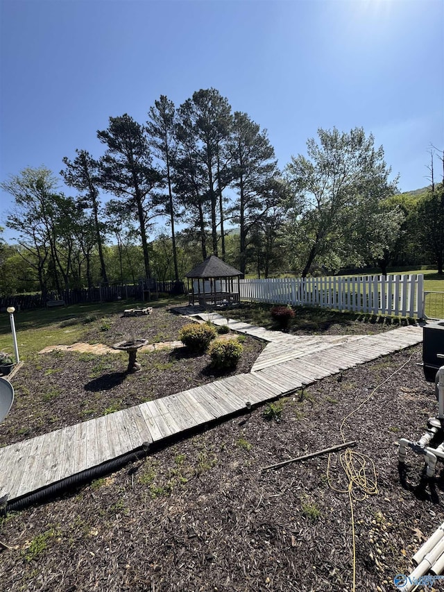 view of yard with a gazebo and fence