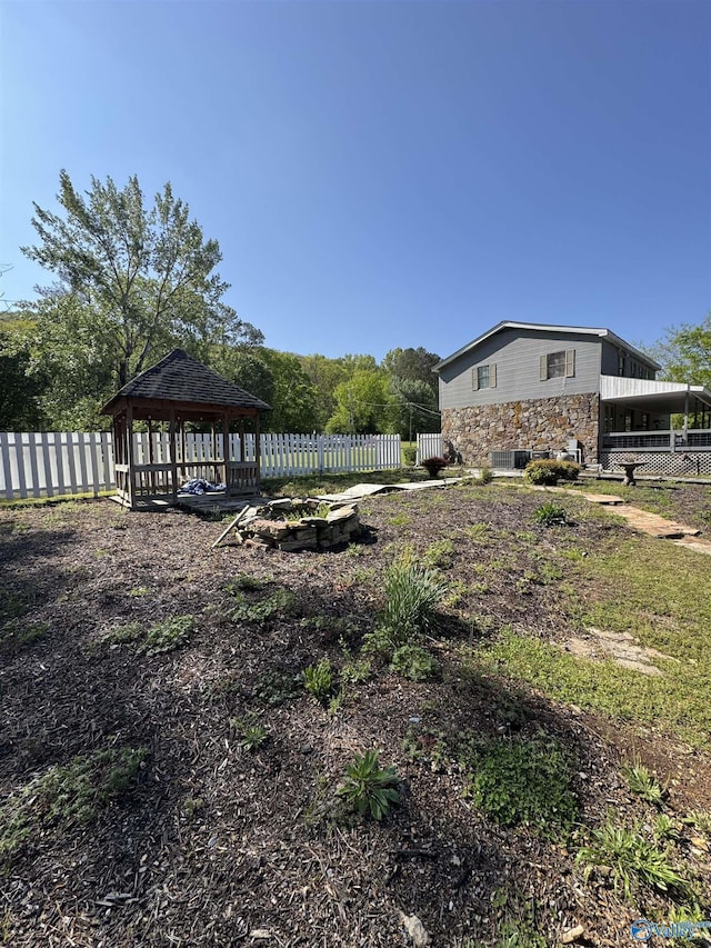 view of yard featuring a gazebo and fence