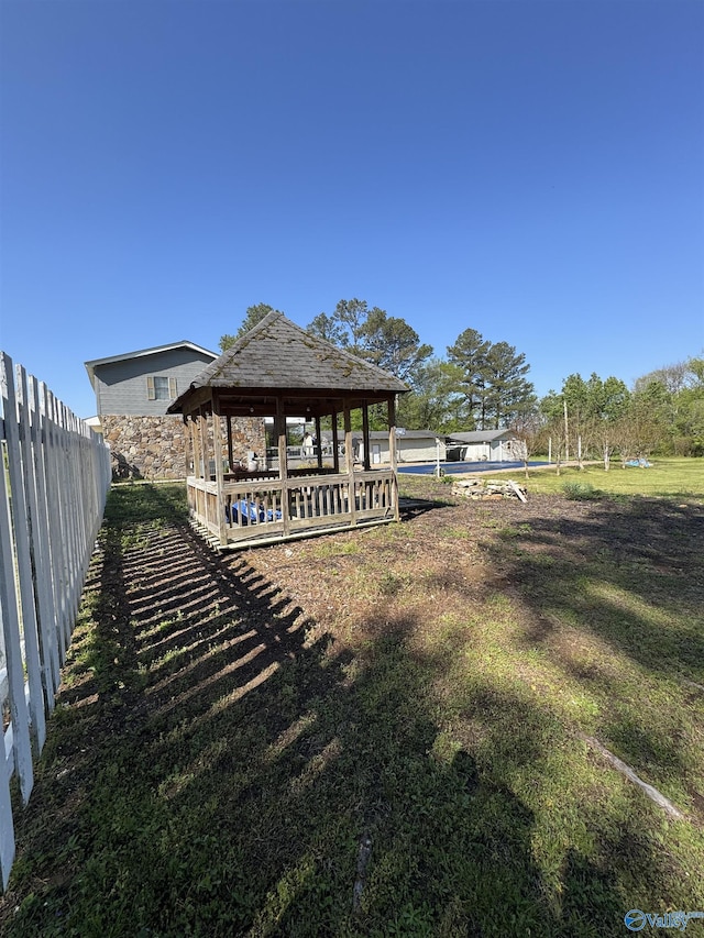 view of yard featuring a gazebo and fence