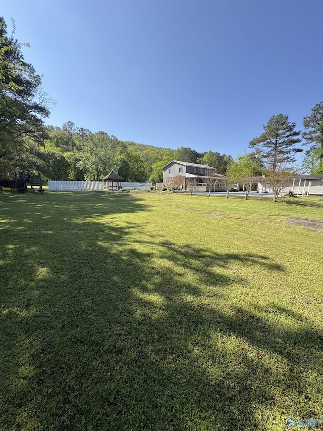 view of yard featuring fence