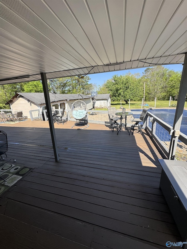 wooden terrace featuring outdoor dining space