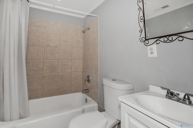 bathroom with vanity, toilet, and shower / bath combo with shower curtain