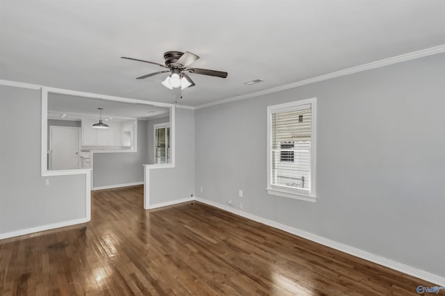 unfurnished living room featuring baseboards, visible vents, ceiling fan, ornamental molding, and dark wood-type flooring