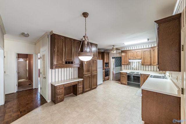 kitchen featuring sink, ceiling fan, ornamental molding, black appliances, and decorative light fixtures