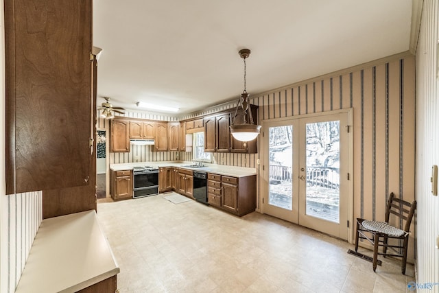 kitchen with electric stove, sink, black dishwasher, decorative light fixtures, and french doors