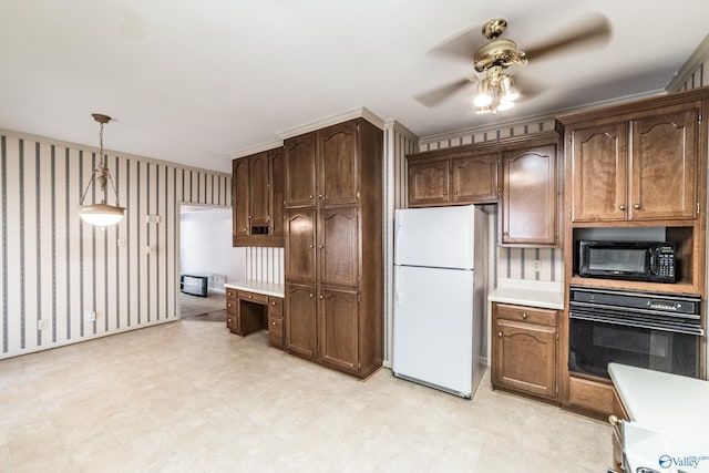 kitchen featuring ceiling fan, decorative light fixtures, dark brown cabinetry, and black appliances