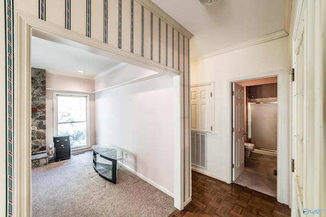 hallway featuring ornamental molding and dark parquet flooring