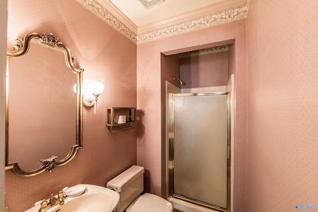 bathroom featuring walk in shower, ornamental molding, toilet, and sink