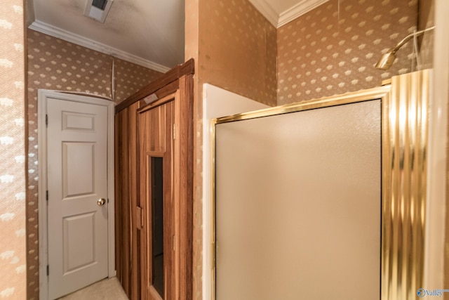 bathroom with an enclosed shower and ornamental molding