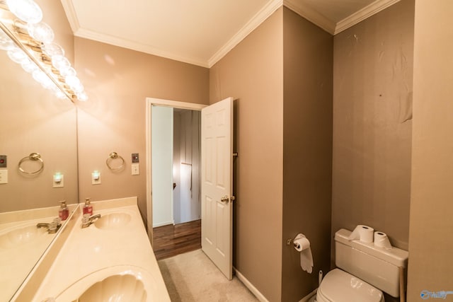 bathroom featuring vanity, crown molding, and toilet