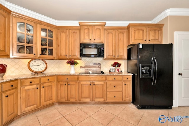 kitchen featuring decorative backsplash, black appliances, light stone counters, and light tile patterned floors