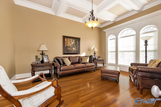 living room featuring coffered ceiling, ornamental molding, hardwood / wood-style floors, and beamed ceiling