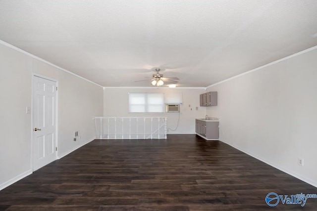 2614 Vista Dr SE, Huntsville, AL 35803 - unfurnished living room with a ceiling fan, crown molding, dark wood-type flooring, and baseboards