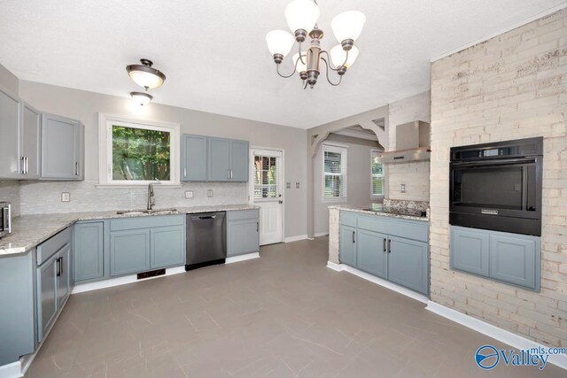 2614 Vista Dr SE, Huntsville, AL 35803 - kitchen featuring black appliances, a sink, backsplash, a chandelier, and baseboards