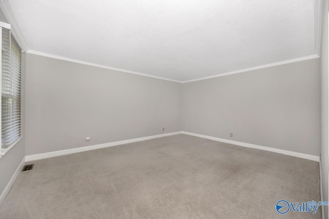 2614 Vista Dr SE, Huntsville, AL 35803 - spare room with carpet floors, baseboards, and ornamental molding