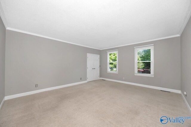 2614 Vista Dr SE, Huntsville, AL 35803 - unfurnished room with ornamental molding, light colored carpet, and baseboards