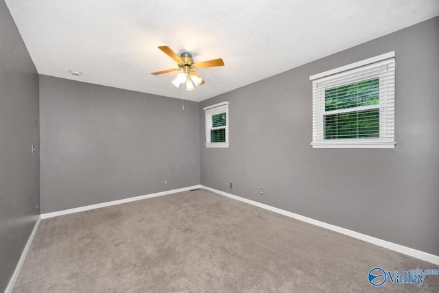 2614 Vista Dr SE, Huntsville, AL 35803 - spare room featuring healthy amount of natural light, a ceiling fan, carpet, and baseboards