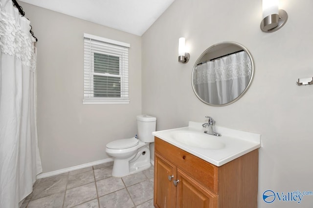 2614 Vista Dr SE, Huntsville, AL 35803 - full bath with toilet, baseboards, vanity, and tile patterned flooring
