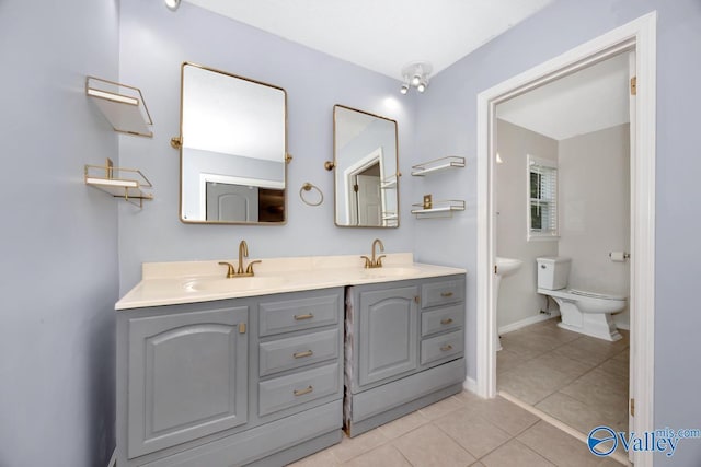 2614 Vista Dr SE, Huntsville, AL 35803 - bathroom with toilet, tile patterned floors, and double vanity