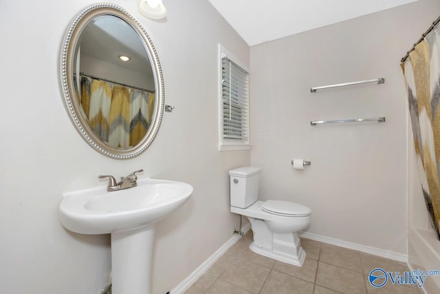 2614 Vista Dr SE, Huntsville, AL 35803 - full bathroom featuring tile patterned flooring, baseboards, toilet, a sink, and curtained shower