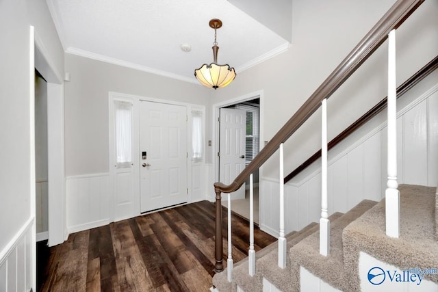 2614 Vista Dr SE, Huntsville, AL 35803 - foyer featuring a decorative wall, wood finished floors, crown molding, stairway, and wainscoting
